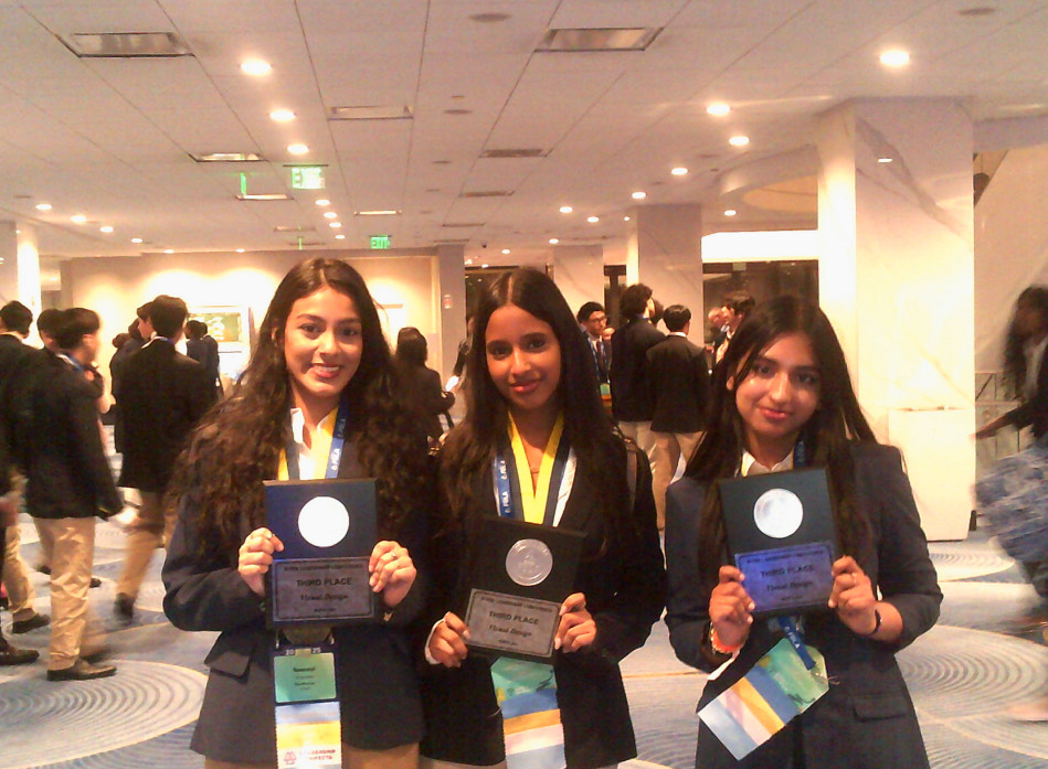 Kate Johnson with awards at business competition